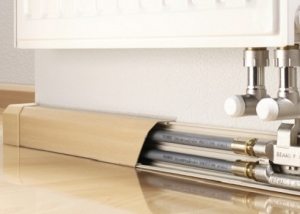 How to effectively hide heating pipes in an apartment or private house